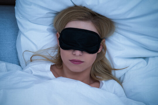 Young Woman Sleeping With Eye Mask