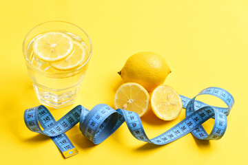 blue meter tape, lemon with freshly squeezed glass of citrus