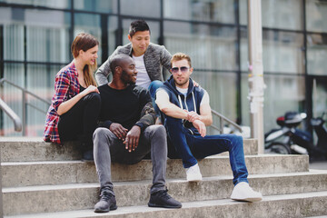 Friends talking on steps