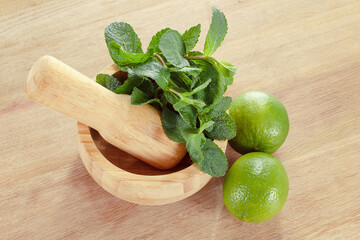 Fresh mint leaves in a mortar