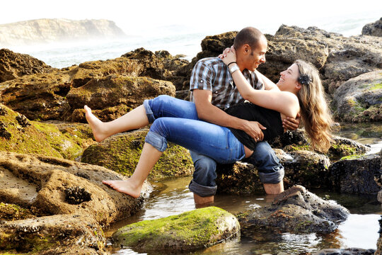 Happy Couple Dating And Teasing On The Beach