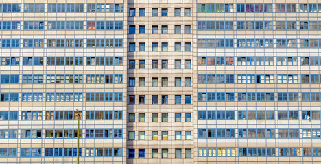 Building facade detail with windows of socialist industrialized apartment block high rises in Eastern Berlin