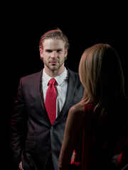 elegant couple in love of man with blonde woman