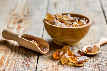 cooking sweets set with different sugar lumps on rustic table background close up