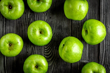 natural food design with green apples dark desk background top view pattern