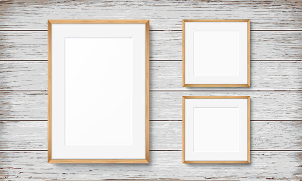 Set of frames on wooden background