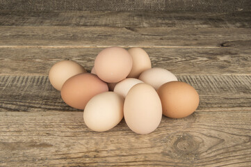 Eggs in a tray on a wooden background