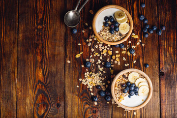 Healthy Breakfast with Granola, Banana and Blueberry.