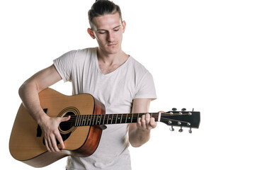 Music and creativity. Handsome young man in t-shirt playing on acoustic guitar. Horizontal frame