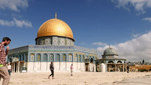 Tourists at the Dome of the Rock in Jerusalem on the top of the Temple Mount timelapse. Golden Dome is the most known mosque and landmark in Jerusalem.