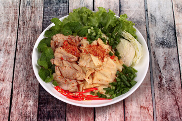 Spicy sour mixed vegetable salad with chicken and bamboo shoots.