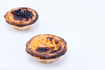 Two delicious egg tart pastry - Pastel de Nata from Portugal isolated on white background