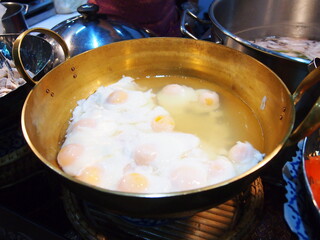 Boil hen egg cooked in light syrup put in the brass pan.