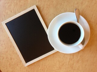 Top view of coffee and chalkboard on table