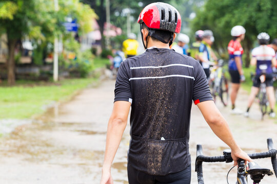 Rear image of a slimy cyclist on the road.