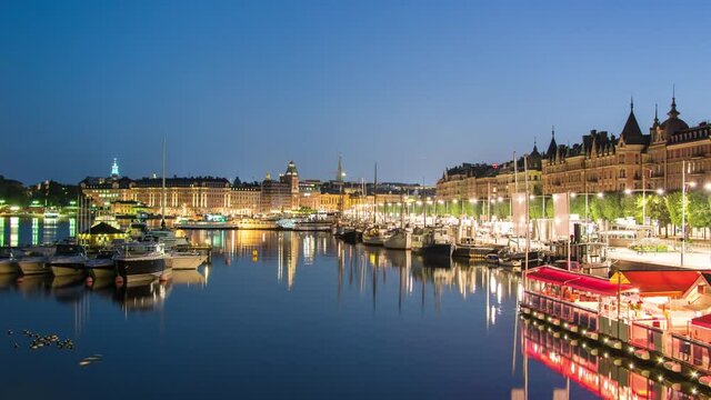 Stockholm city canal at night 4K Time Lapse Tilt. Strandvagen in central Stockholm, Sweden