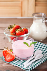 Strawberry yogurt and milk on a table. Selective focus. Copy space