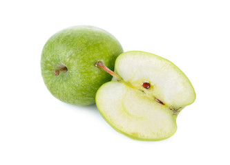 whole and half cut fresh green apple with stem on white background