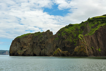 Obraz premium Rocks in Avacha Bay of the Pacific Ocean. The coast of Kamchatka.