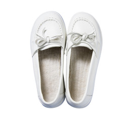 Lady white leather shoes isolated on a white, top view