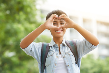 Showing Heart Gesture Outdoors