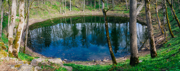 Lake in Kaali meteorite crater by springtime, Saaremaa © alexpolo