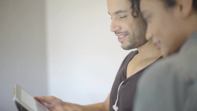 Friends using digital tablet together