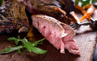 juicy grilled steaks on a cutting board