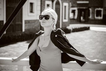 Obraz premium Beautiful woman travels on a Europe and have good mood and stylish clothes