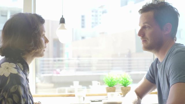 Man and woman together in coffee shop