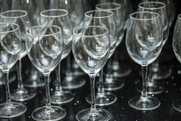 crystal wine glasses on black background