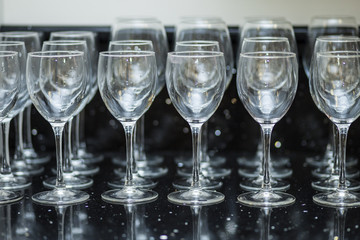 crystal wine glasses on black background