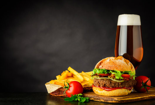 Beer with Burger and French Fries on Copy Space