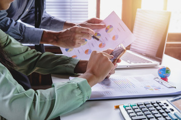 Two colleagues discussing data