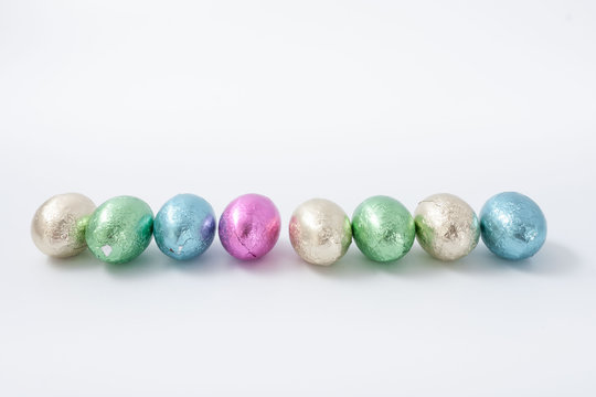 Multi-colored easter chocolate eggs in colored foil