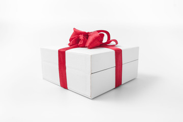 White box with a red bow gift