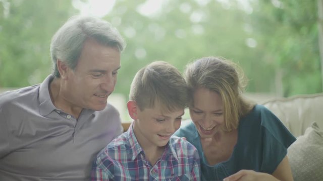 Family looking at smartphone together