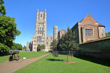 View of The West front of the Cathedral from a public garden with a gun in the foreground in Ely, Cambridgeshire, Norfolk, UK