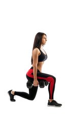 Fototapeta na wymiar A slender athletic woman shows a dumbbell exercise in the hands of a dumbbell, a right foot in front, a full squat position, on a white background.