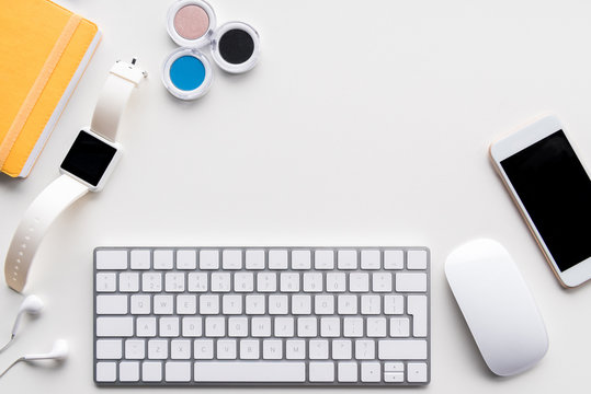 flat lay with computer keyboard, smartwatch, smartphone and office supplies isolated on white