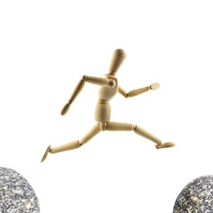 Wooden mannequin is jumping over the abyss isolated on white background. Challenge concept