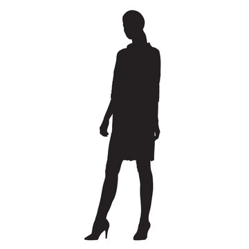 Standing business woman dressed in short dress, vector silhouette