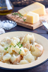 Mashed boiled potatoes with cheese and butter