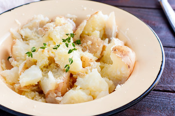 Mashed boiled potatoes with cheese and butter