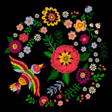 Embroidery ethnic colorful pattern with bird and fantasy flowers. Vector embroidered traditional floral design for fashion fabric.