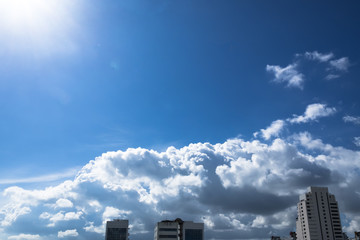 Fototapeta na wymiar Beautiful skyscape of the city with cloudy sky in shiny day