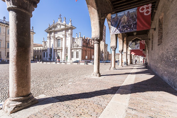 people and Mantova Duomo Cathedral on Piazza Sordello (Piazza San Pietro) in Mantua. The current...