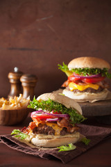 bacon cheese burger with beef patty, tomato and onion
