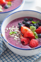healthy berry smoothie bowl with strawberry blueberry raspberry and chia seed