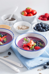 healthy berry smoothie bowl with strawberry blueberry raspberry and chia seed
